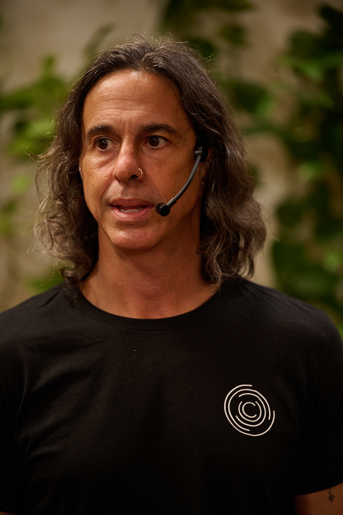 Dean Grafos speaking on stage